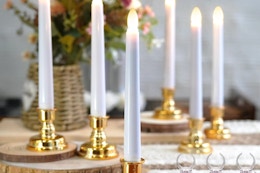 FPOO 6PCS Christmas Window Candles with Timer on a kitchen table.