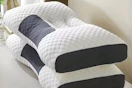neck pillows on bed