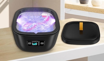 a retainer cleaner machine on a table