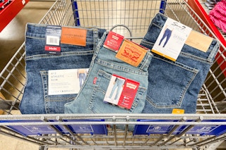 3 pairs of jeans in a cart
