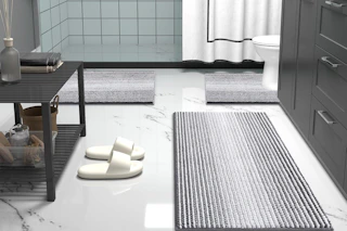 striped bathroom rugs on floor
