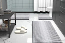 striped bathroom rugs on floor