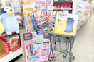 walgreens cart with barbie, keurig, and hotwheels products