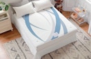 a mattress pad on a bed in a room