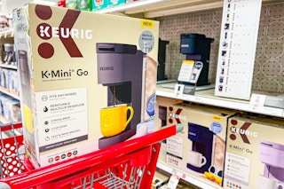 keurig k-mini-go coffee maker sitting on a target cart