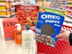 hand holding post oreo ceral with cora neutrogena hempz and digiorno on target shelf