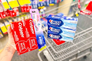 crest and colgate toothpastes with an oral b toothbrush