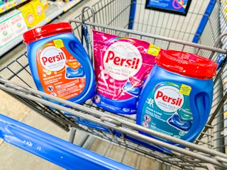 three packages of Persil pacs in a Walmart cart