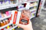 hand holding neutrogena acne care cleansers at cvs