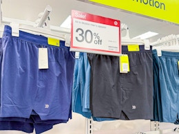 mens shorts on hangers at a store
