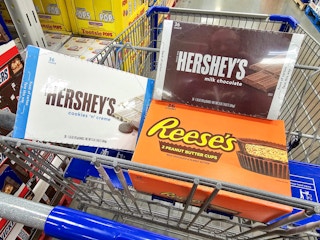 boxes of hersheys and reeses candy bars in a cart