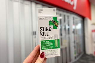 hand holding a box of Sting-Kill