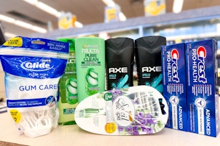pack of flossers, two bottles of garnier, axe, crest toothpaste, and bic razors on store counter