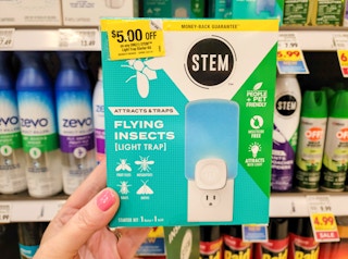 hand holding a stem flying insects light trap starter kit at kroger
