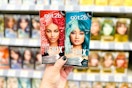 person holding 2 boxes of hair color