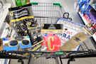 cart full of graduation themed party supplies