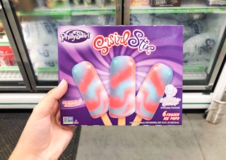 phillyswirl swirl stix ice pops held in front of dollar tree freezers