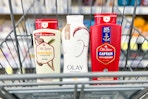 old spice and olay body wash in a cart