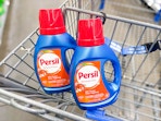 34-ounce Persil detergent bottles in a Walmart cart