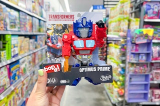 hand holding bop it transformers game in walmart toy aisle