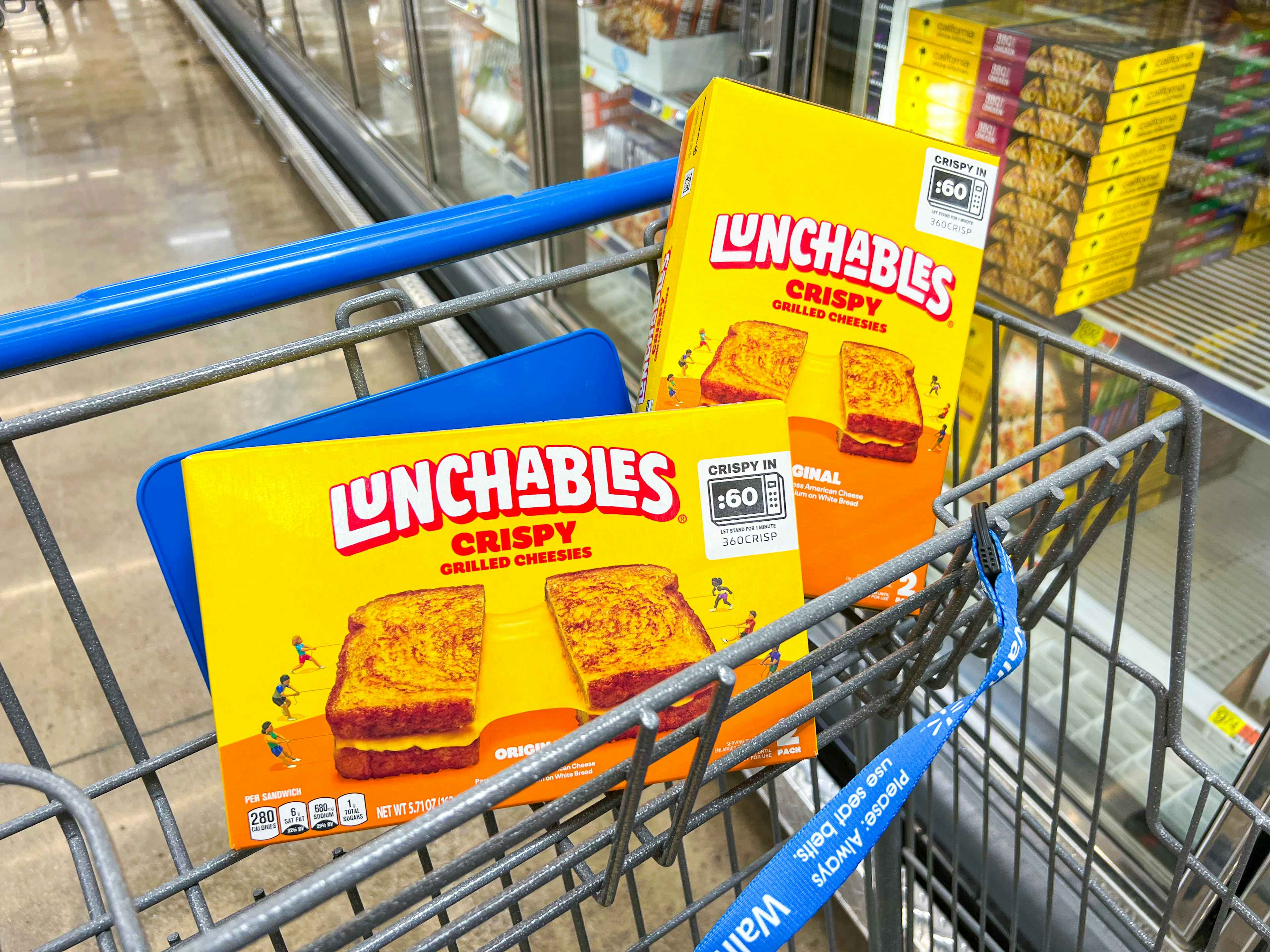 two boxes of lunchables grilled cheesies in walmart cart