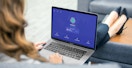 person with feet up connecting to vpn on laptop