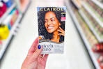 person holding a box of clairol nice n easy hair color in an aisle