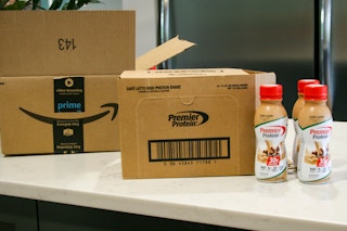 premier protein shakes next to boxes