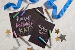 Bic metallic markers scattered around signs