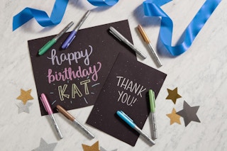 Bic metallic markers scattered around signs