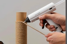 hot glue gun being used on twine