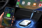 CarEase Wireless CarPlay Adapter plugged into a car.