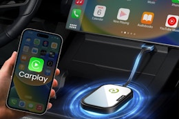 CarEase Wireless CarPlay Adapter plugged into a car.