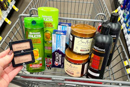 maybelline eyeshadow, garnier shampoo, crest toothpaste, shea moisture hair gel, and tresemme shampoo in a cart