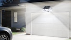 a solar flood light above a garage door
