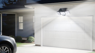 a solar flood light above a garage door