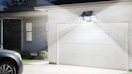 a solar flood light above a garage door