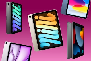 Various models of Apple iPads on a pink background