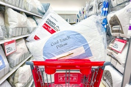 target bed pillows sitting in a cart in a bedding aisle