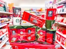 five starbucks gift sets piled on top of target cart in aisle