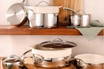 Bloomhouse 12 Piece Triply Stainless Steel Pots and Pans Cookware Set on kitchen shelving.