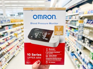 hand holding blood pressure monitor