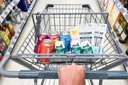 hand pushing a cart full of walgreens groceries