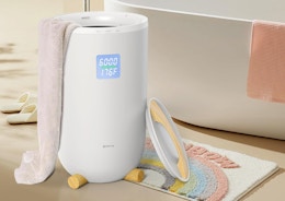 a towel warmer next to a bathtub