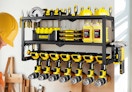 a power tool organizer on a wall with tools 