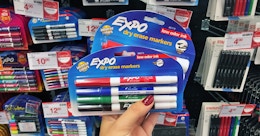 hand holding expo dry erase markers at staples
