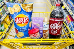 groceries in a yellow shopping cart