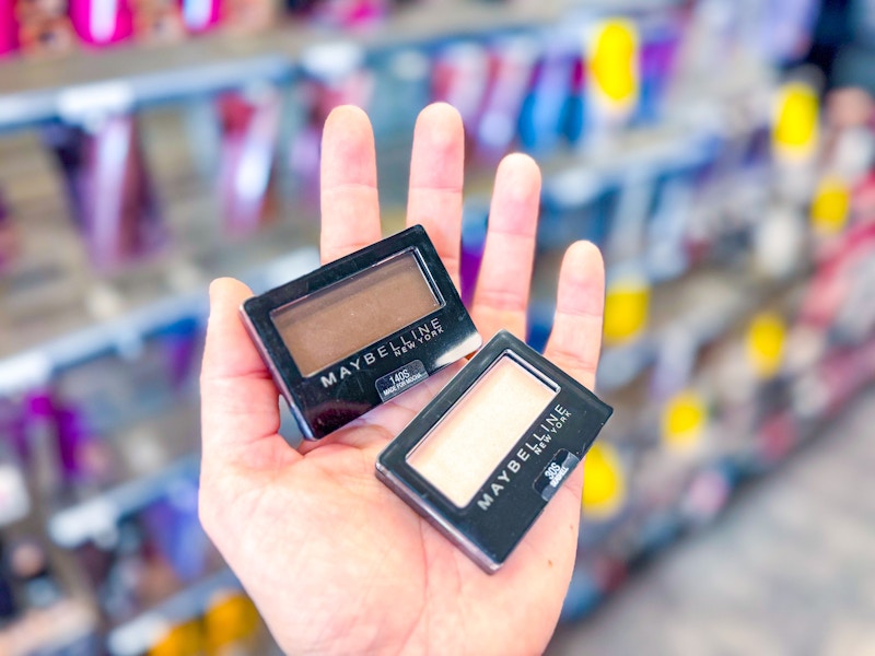 hand holding two maybelline eyeshadow singles