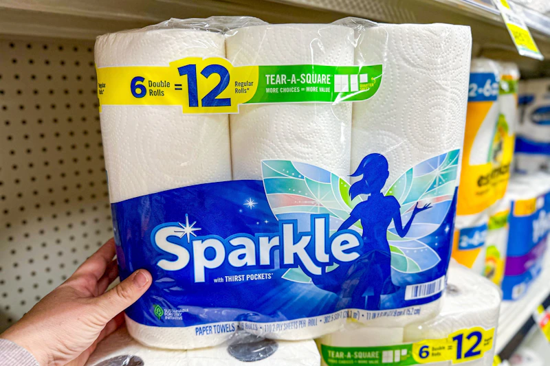 hand touching a pack of sparkle paper towels