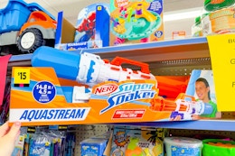 hand holding up a nerf super soaker